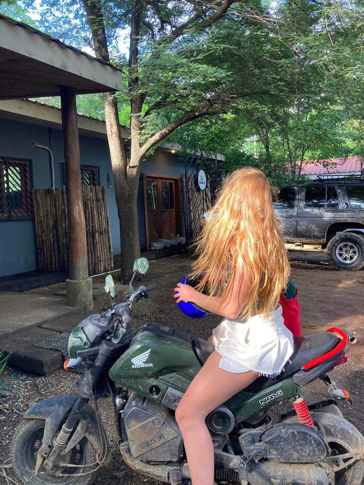Traveler on a green Honda Navi in San Juan del Sur